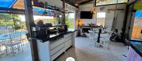 Mini-fridge, microwave, cookware/dishes/utensils, dining tables
