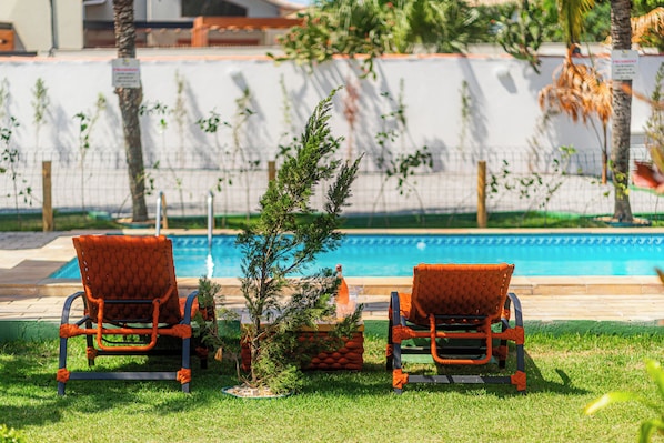 Outdoor pool, open 9:00 AM to 8:00 PM, pool umbrellas, sun loungers