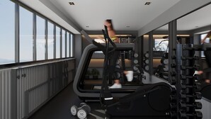 Un gimnasio moderno con equipo de ejercicio, ventanas amplias y vistas a la ciudad.