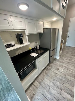 Fridge, microwave, coffee/tea maker, toaster
