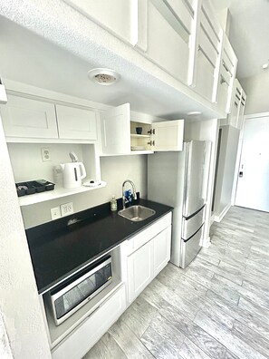 Fridge, microwave, coffee/tea maker, toaster