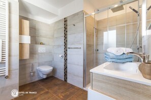 Shower, hair dryer, towels, soap
