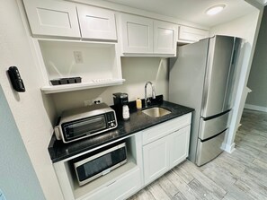 Fridge, microwave, coffee/tea maker, toaster