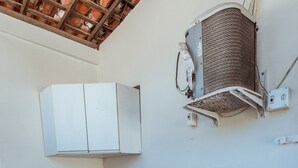 A compact laundry area with a washing machine, a small sink, and a cabinet. - Casa c 5 su tes Piscina Churrasqueira e Sinuca (Cabedelo)