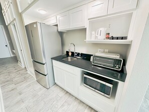 Fridge, microwave, coffee/tea maker, toaster