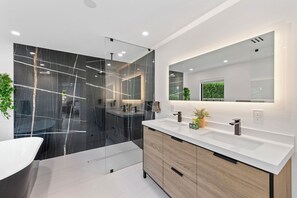 Shower, hair dryer, towels, soap