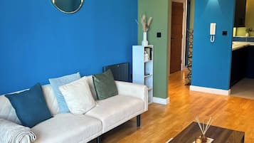 Apartamento, 1 quarto, vista para a cidade | Sala de estar | Livros