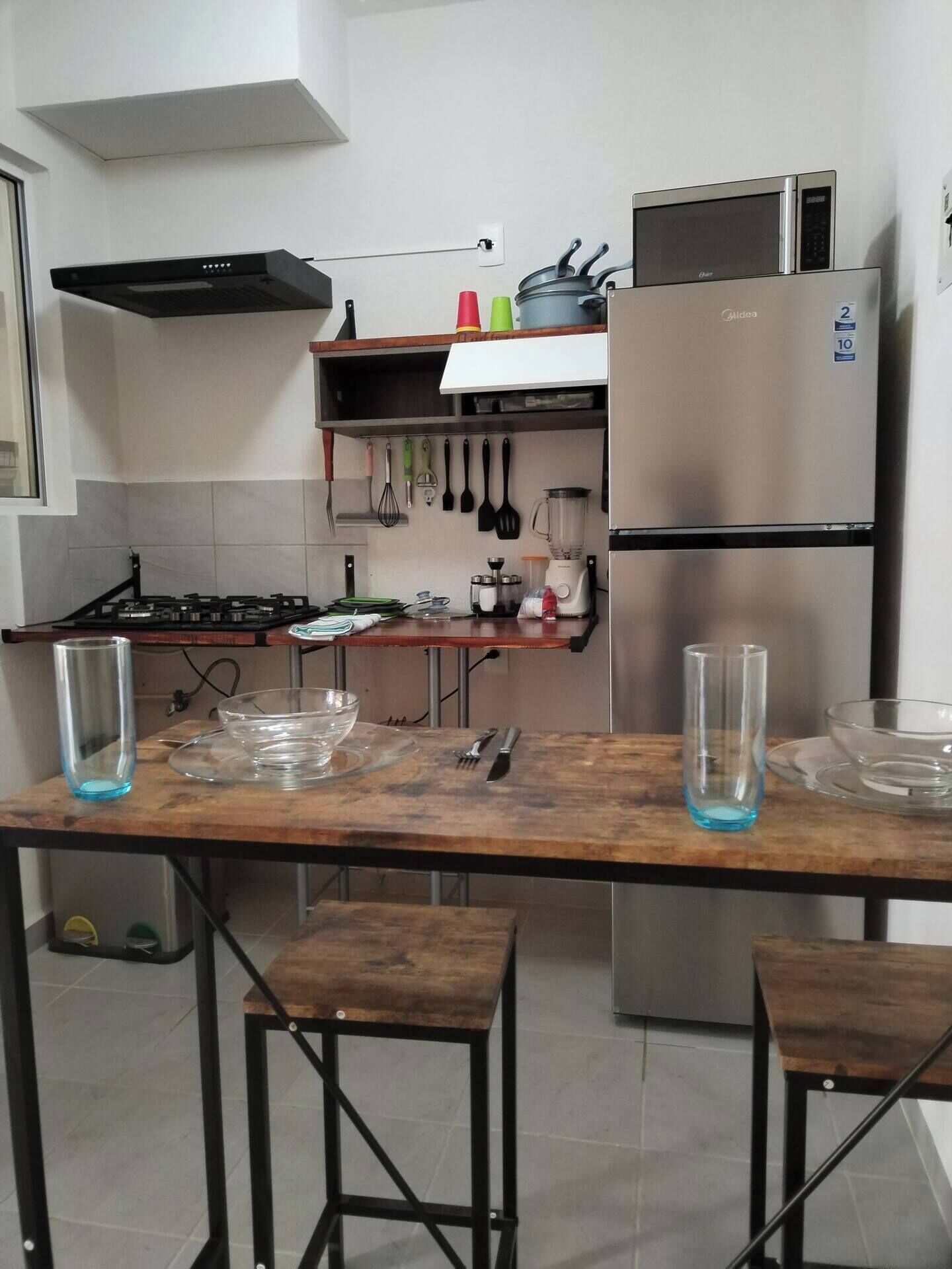 Fridge, microwave, stovetop, cookware/dishes/utensils