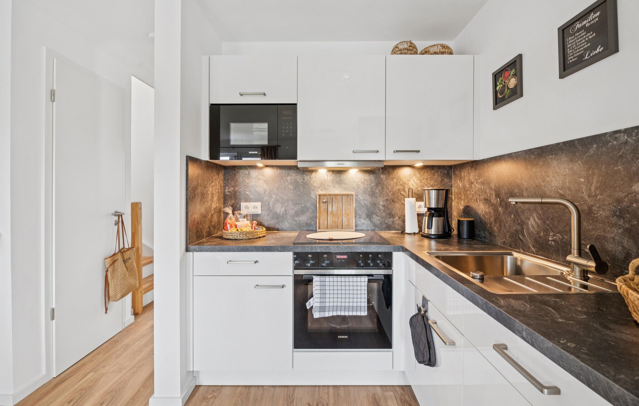 Fridge, stovetop, dishwasher, coffee/tea maker