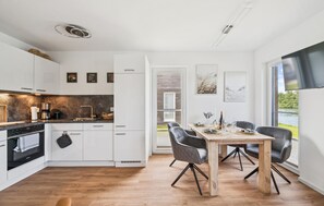 Fridge, stovetop, dishwasher, coffee/tea maker