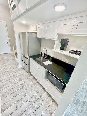 Fridge, microwave, coffee/tea maker, toaster