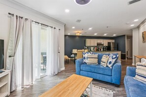 Condo, Multiple Beds, Hot Tub, Pool View (Ocean Gate I104) | Living area | TV