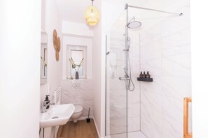 Shower, hair dryer, towels, soap