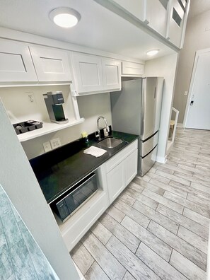 Fridge, microwave, coffee/tea maker, toaster