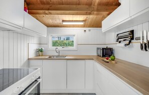 Fridge, stovetop, dishwasher, coffee/tea maker