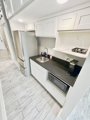 Fridge, microwave, coffee/tea maker, toaster