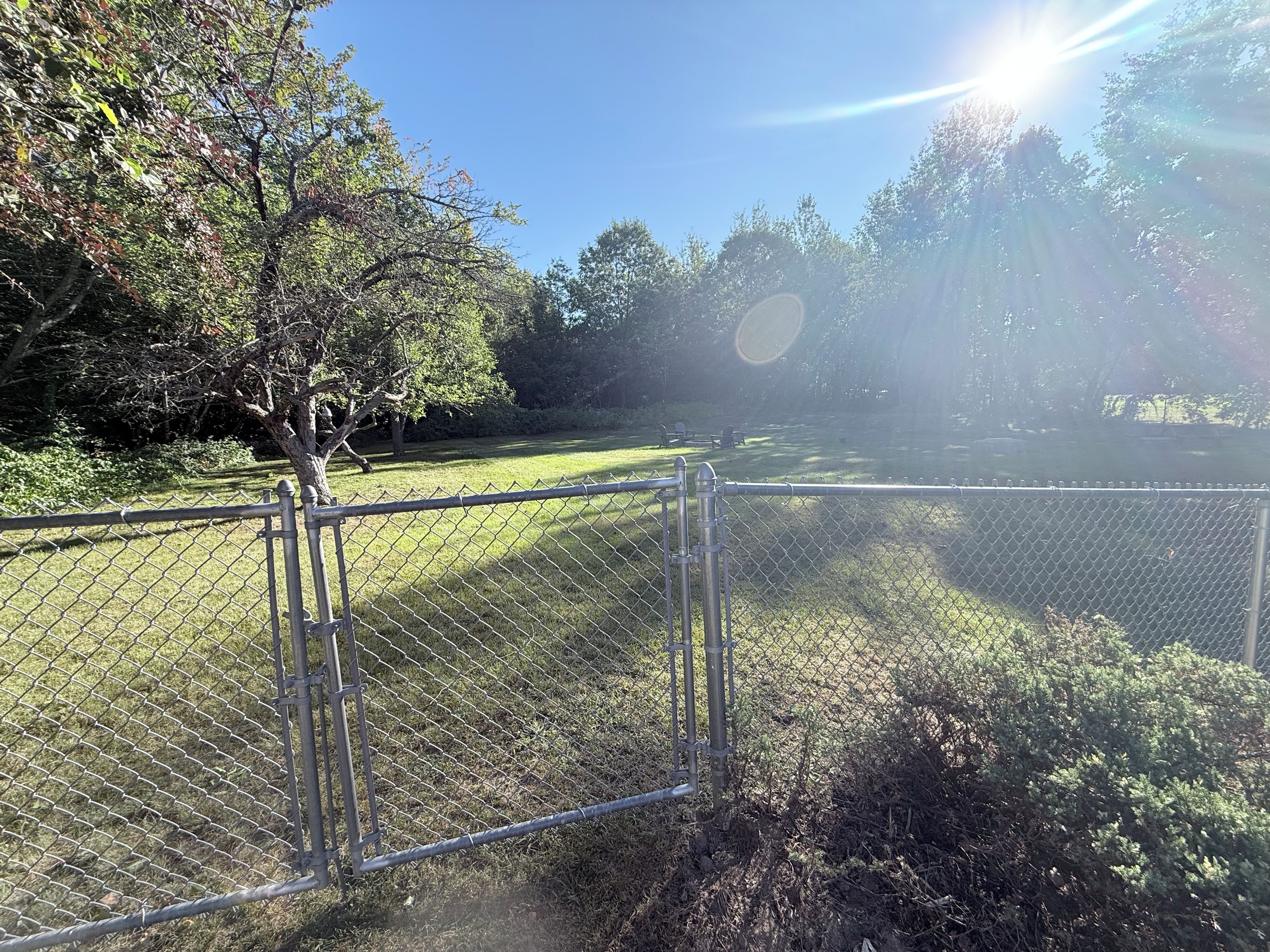 Photo taken from fenced in area overlooking fire pit 
