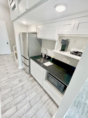 Fridge, microwave, coffee/tea maker, toaster