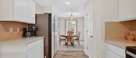 Toaster, cookware/dishes/utensils, spices, dining tables