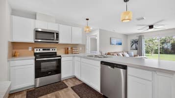 Toaster, cookware/dishes/utensils, spices, dining tables