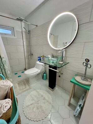 Shower, hair dryer, towels, soap