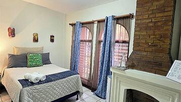 Double Room, Garden View | Iron/ironing board, free WiFi, bed sheets