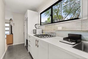 Microwave, stovetop, toaster, cookware/dishes/utensils