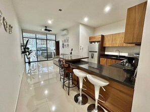 Fridge, microwave, stovetop, coffee/tea maker