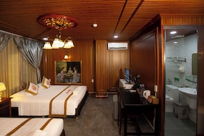 A hotel room with two beds, a desk, a television, and a bathroom. - The Rice Hotel & Tour - 180 Bui Vien (Ho Chi Minh City)
