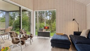 A modern living room with a sofa, chairs, a table, and a lamp. - "Aggi" - 850m from the sea by Interhome (Fårevejle)