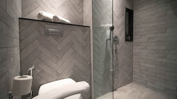 Shower, hair dryer, slippers, towels