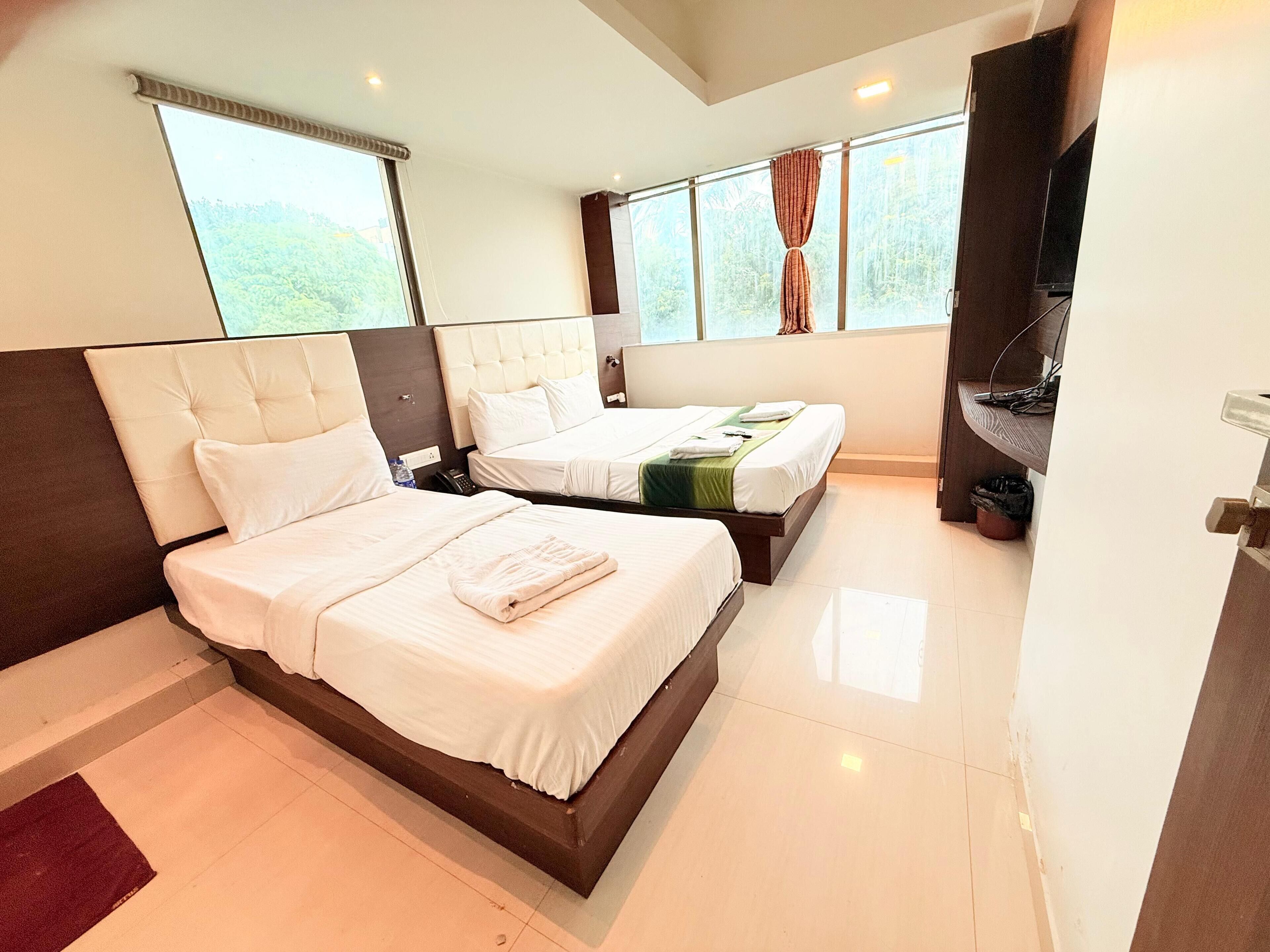 Deluxe Triple Room, City View | Iron/ironing board, free WiFi