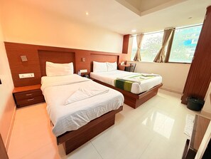 Deluxe Triple Room, City View | Iron/ironing board, free WiFi