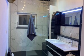 Shower, hair dryer, towels, soap