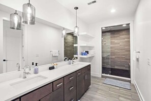 Shower, hair dryer, towels, shampoo