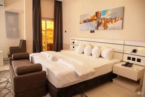 Economy Room, Balcony, City View | Desk, laptop workspace, blackout drapes, soundproofing