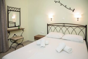 Economy Double Room, Balcony, Garden View | In-room safe, blackout drapes, iron/ironing board, free WiFi