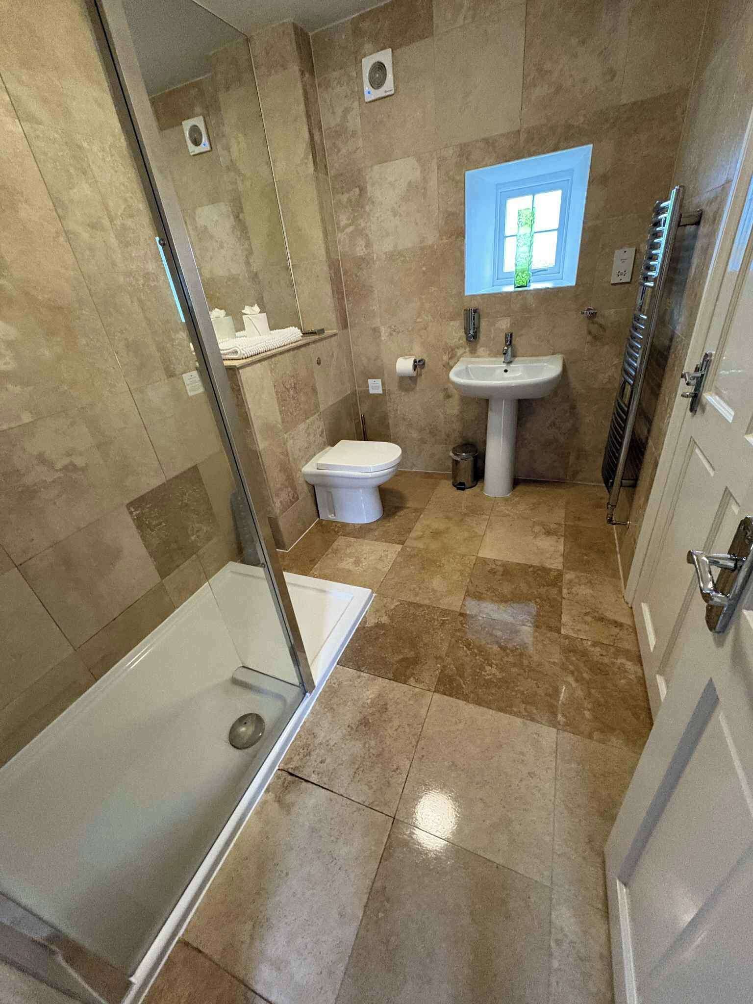 Separate tub and shower, deep soaking tub, hair dryer, towels