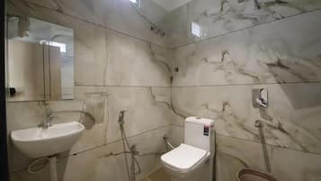 Deluxe Room, City View | Bathroom | Shower, towels, soap, toilet paper