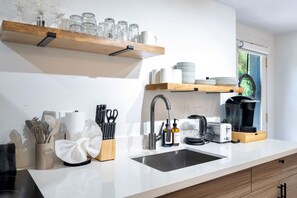 Fridge, microwave, stovetop, coffee/tea maker