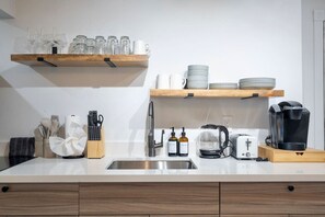 Fridge, microwave, stovetop, coffee/tea maker