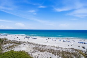 A beach with white sand, clear blue water, and a wooden boardwalk. - E1102 Directly on the Beach! Dunes of Panama Vacation Rentals (Panama City)