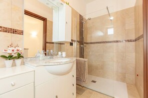 Hair dryer, towels, soap, shampoo
