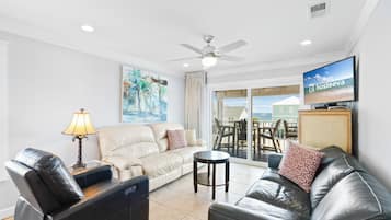 Signature Condo, Non Smoking, Balcony | Living room | 65-inch Smart TV with cable channels