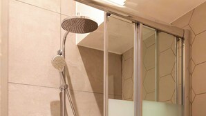 A modern bathroom with a glass shower enclosure, a white cabinet, and a towel rack. - Amazing Apartment - 2br/6p - Nation (Paris)