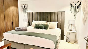 1 bedroom, desk, iron/ironing board, travel crib
