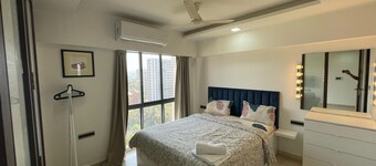 Business-Ready Apt near Jio World Centre | 1BR + Gym + Pool