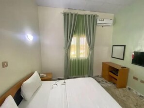 Family Apartment, Balcony, City View | In-room safe, desk, laptop workspace, blackout drapes