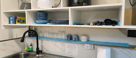 Fridge, microwave, electric kettle, cookware/dishes/utensils