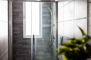 Shower, hair dryer, towels, toilet paper